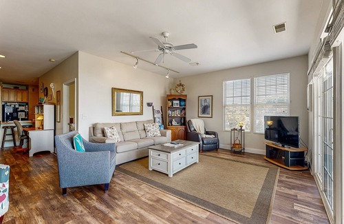 Folly Beach Condo | First-floor villa w/partial ocean views, covered porch -one block from the beach