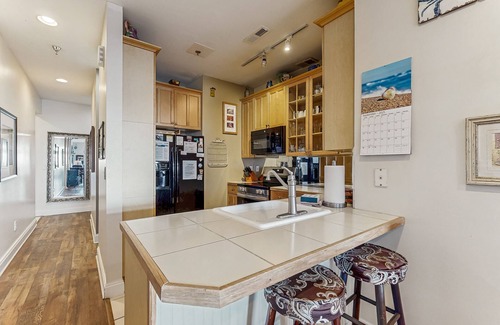 Folly Beach Condo | First-floor villa w/partial ocean views, covered porch -one block from the beach
