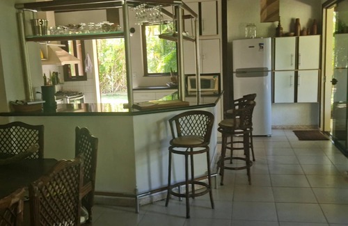 Guaiu House | Flower house on the edge of Guaiú beach in a high-standard condominium.