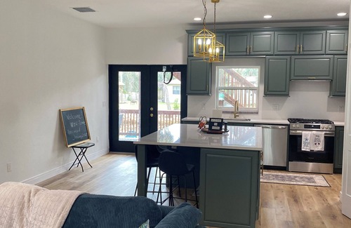 Astor House | Forget your worries in this serene space. New 4-bedroom 4 bath house in Astor