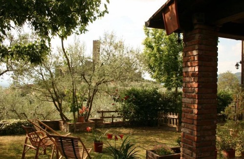 Montecchio Villa | Fully detached and fenced stone cottage with an outside porch. Garden equipped with table, chairs, d