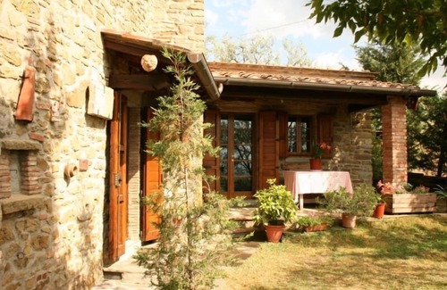 Montecchio Villa | Fully detached and fenced stone cottage with an outside porch. Garden equipped with table, chairs, d