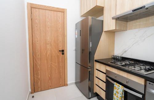 Tangier Apartment | Glorious Garden, Appartement Familial, Face au Stade Ibn Batouta, Espaces Verts, Proche Aéroport, Parking, WIFI, AC, IPTV