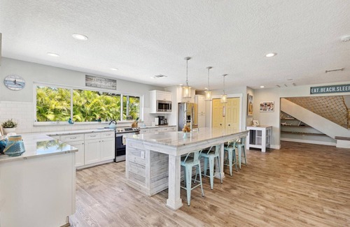 Cocoa Isles House | Gorgeous Private Canal Home w/Heated Pool, Hot Tub & Modern Kitchen - Walk to Restaurants!