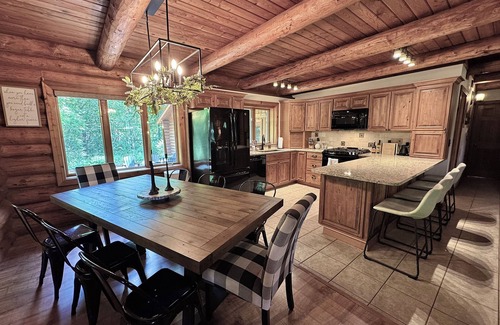 Lawndale Cabin | Gorgeous XL Log Cabin in Bloomington, IL! 2 Game Rooms + Hot Tub & Sauna!