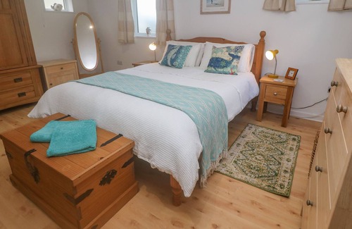 Porthcurno Apartment | GROUND FLOOR THE HAYLOFT, family friendly, with a garden in Sennen