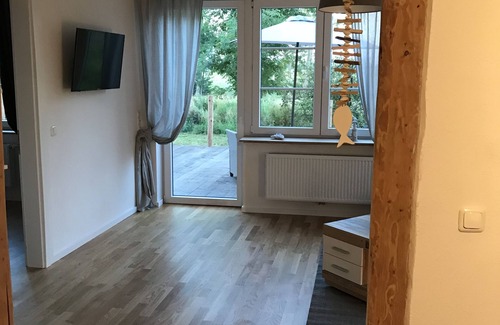 Grosefehn Apartment | Gulfhof vacation apartment "Wangerooge" with a view of the nature reserve