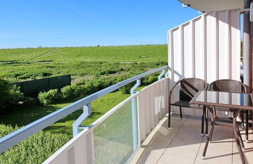 Schillig Apartment | Hübsche Ferienwohnung am Meer mit Balkon und Blick zum Grünen Nordseedeich