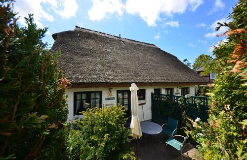 Gross Zicker House | Historical Thatched with a separate entrance with transom windows and shutters