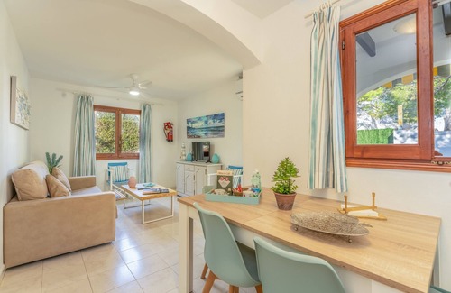 Cala Blanca Apartment | Holiday Apartment “Apartamento Delfín 1” with Pool, Terrace & WiFi; Parking Available in the Street
