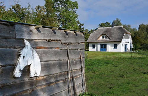 Puddemin House | Holiday home with thatched roof, large property and private road to the port