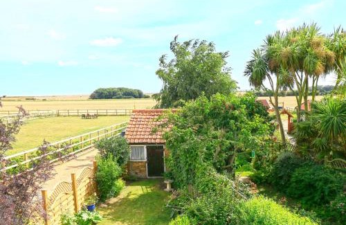 Bawdsey House | Hollyhocks