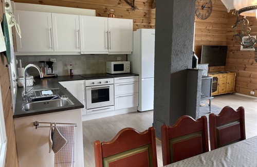 Hareid Cabin | Holyday home (2016-built) with view plot beyond Fjord and Mountains.