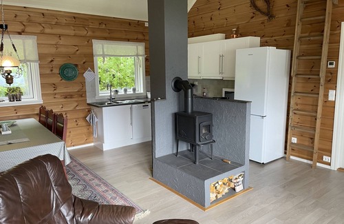 Hareid Cabin | Holyday home (2016-built) with view plot beyond Fjord and Mountains.