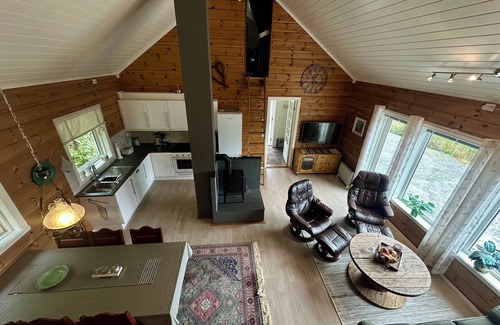 Hareid Cabin | Holyday home (2016-built) with view plot beyond Fjord and Mountains.