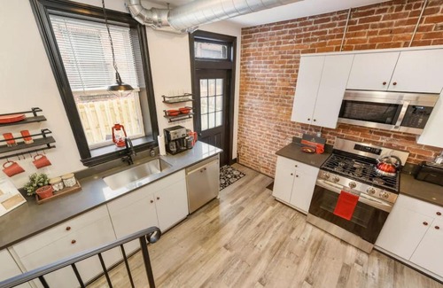 Lawrenceville House | HostWise Stays - Prime Location in Lawrenceville, Exposed Brick 2BR Home