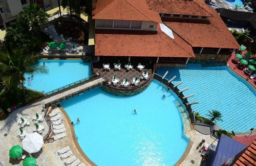 Prive das Caldas Apartment | Hot Springs apartment with bathtub and 24h pool access