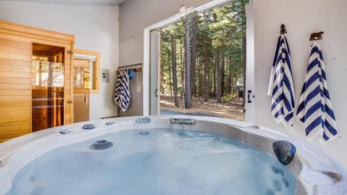 McKinney Estates House | Hot Tub Sauna Game Room Modern 5BDR Family Cabin Homewood by AvantStay