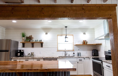 Checotah House | House on the lake with a large sandy beach just steps from the back door.