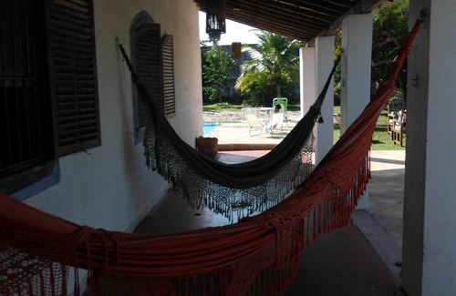 Praia da Vila House | House surrounded porch, 4 bedrooms, pool, barbecue and volleyball court