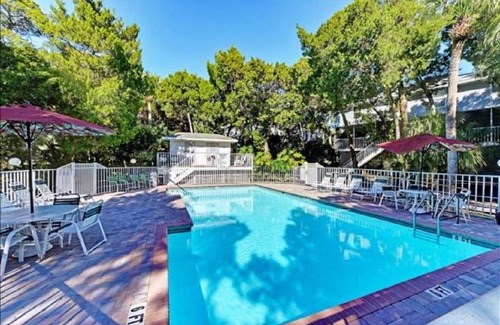 Holmes Beach House | In The Midst of Palms by AMI Locals