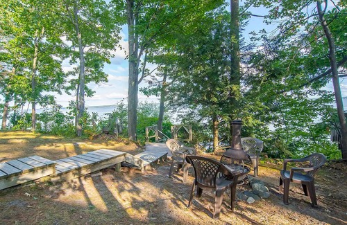 Indian River House | Incredible lakefront retreat with dock, fire pit, decks, yard, & amazing views