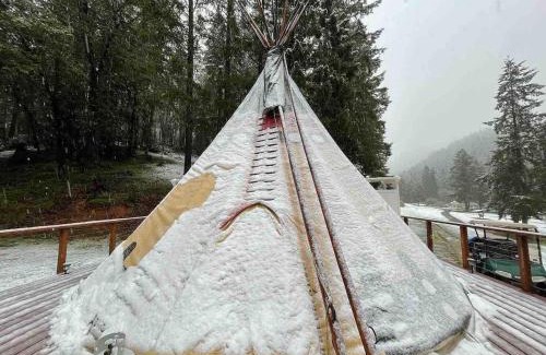 Leland Other | Indulge in the ultimate Glamping experience with our Luxury Tipi packages featuring four unique sites with private decks, indoor and outdoor fire pits, and exclusive access to 155 acres of private hiking trails