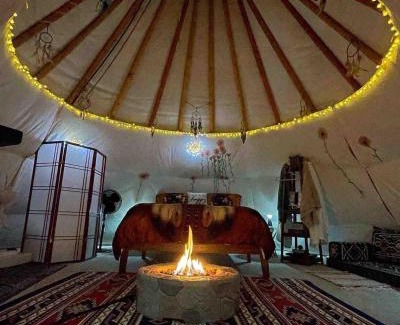 Leland Other | Indulge in the ultimate Glamping experience with our Luxury Tipi packages featuring four unique sites with private decks, indoor and outdoor fire pits, and exclusive access to 155 acres of private hiking trails