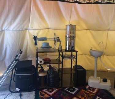 Leland Other | Indulge in the ultimate Glamping experience with our Luxury Tipi packages featuring four unique sites with private decks, indoor and outdoor fire pits, and exclusive access to 155 acres of private hiking trails