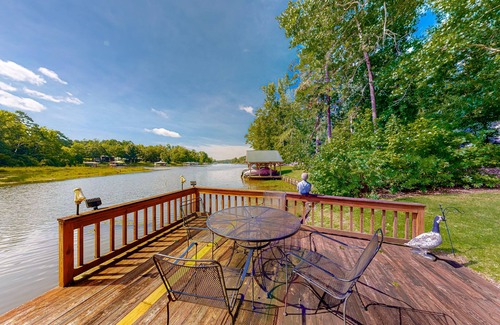 Hardwick House | Inviting waterfront home with fireplace, dock, patio, central AC, & W/D