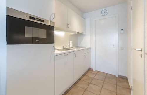 De Haan Apartment | Isabelle with parking and shared pool by Interhome