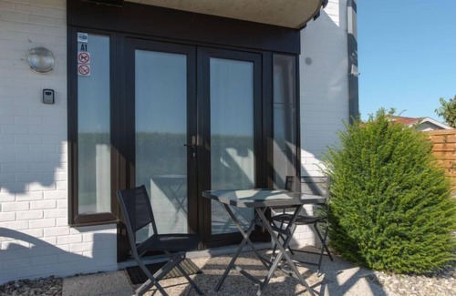 De Haan Apartment | Isabelle with parking and shared pool by Interhome