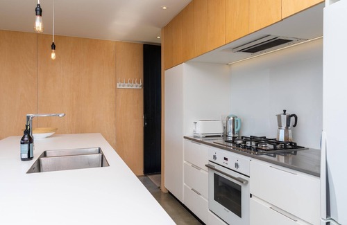 Mangawhai House | Island View - Designer holiday home with fabulous indoor outdoor living and spectacular views