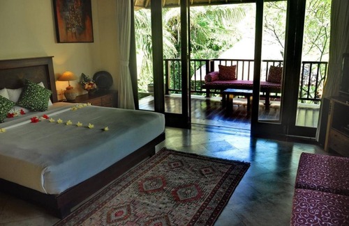 Sukawati House | Junior Suite room in Sukawati, surrounded by lush gardens