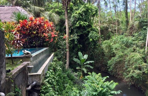 Sukawati House | Junior Suite room in Sukawati, surrounded by lush gardens