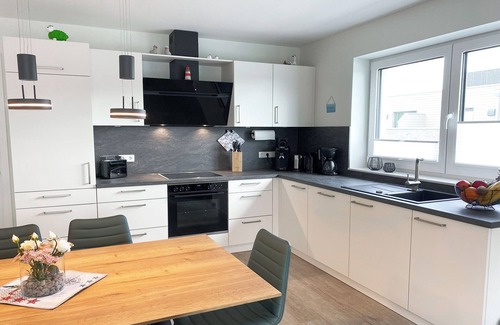 Tossens Apartment | KÜSTE33/48 - Family time. Sauna. Roof terrace.