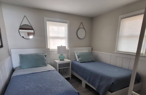 Traverse City Cottage | Lake Leelanau Waterfront Cottage with Mini Harbor - Close to Traverse City!
