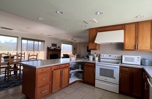 Oak Shores House | Lakefront Chateaux with Dock, Unique Rock Wall for Privacy, and Internet