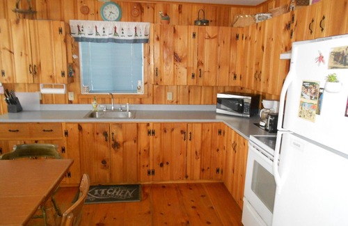 The Bays Cottage | Lakefront Cottage with 100' Sandy Beach, Dock, Views and Game Room.