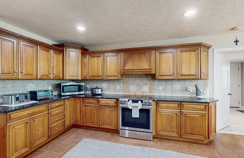 Mineral House | Lakefront with pool, hot tub, dock, SUPs, water carpet, billiards, foosball, gym
