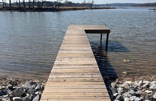 Lincoln House | Lakeside Luxury: Covered RV Site with Upgraded Patio and Private Pier