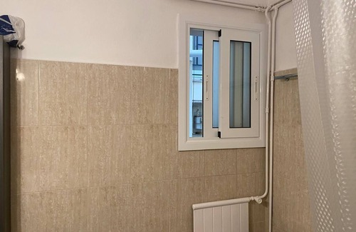 Sant Gervasi – la Bonanova Apartment | Large double bedroom with desk, double bed, large wardrobe and window.