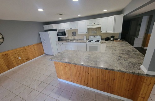 Marion House | Large Lake front, split level home. Sleeps 18, fully remodeled & coffee bar.