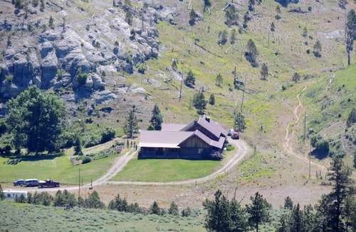 Big Timber House | Large log building in the country near a creek