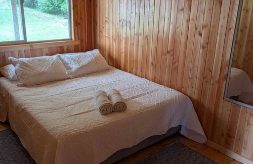 Ancud Cabin | Lazy Koala Stays - wood cabin, hot tub (tinaja), bay views in a quiet area