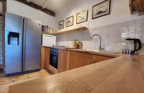 Celles Cottage | Le Grenier, a charming gîte on the side of a hill. Stunning views, stunning pool