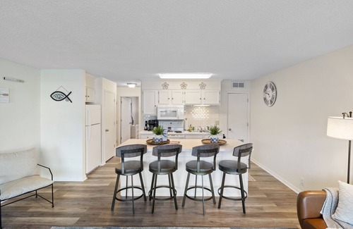 Village of Four Seasons Condo | Light filled condo with balcony, water views, grill & shared amenities