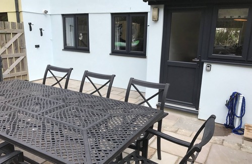 Porthtowan House | Located 60m from beach and situated opposite the sand dunes. Loved by families.
