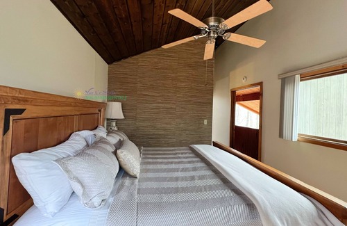 Maple City Cabin | Lodge-style multi-level home at the Homestead in Glen Arbor. Deck with grill.