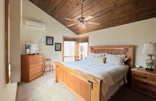 Maple City Cabin | Lodge-style multi-level home at the Homestead in Glen Arbor. Deck with grill.